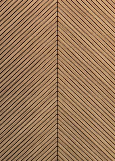 Wood composite slat sample, chevron oak in tone.