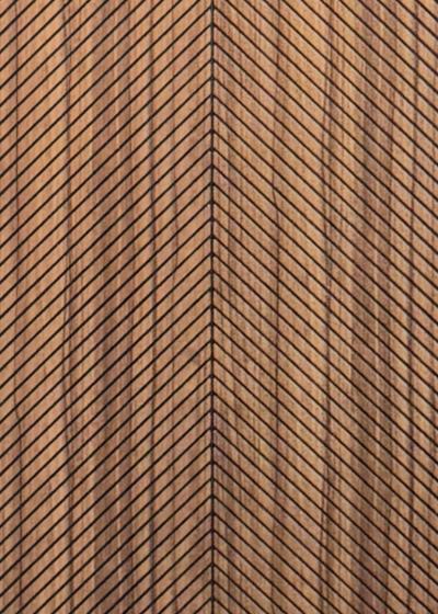 Wood composite slat sample, chevron walnut in tone.