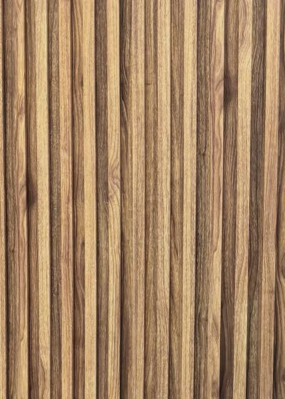 Wood composite slat sample, honey oak in tone.